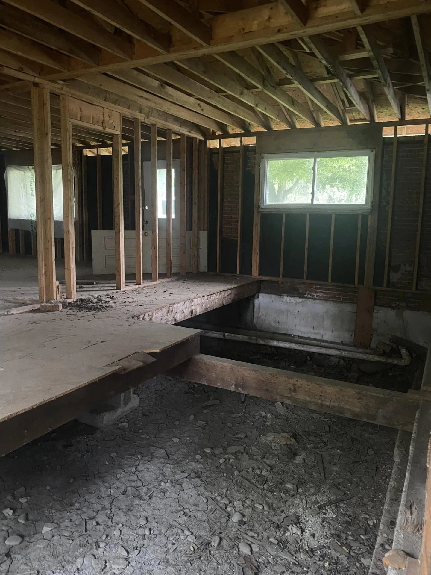 Interior of a house stripped to the framing during renovation