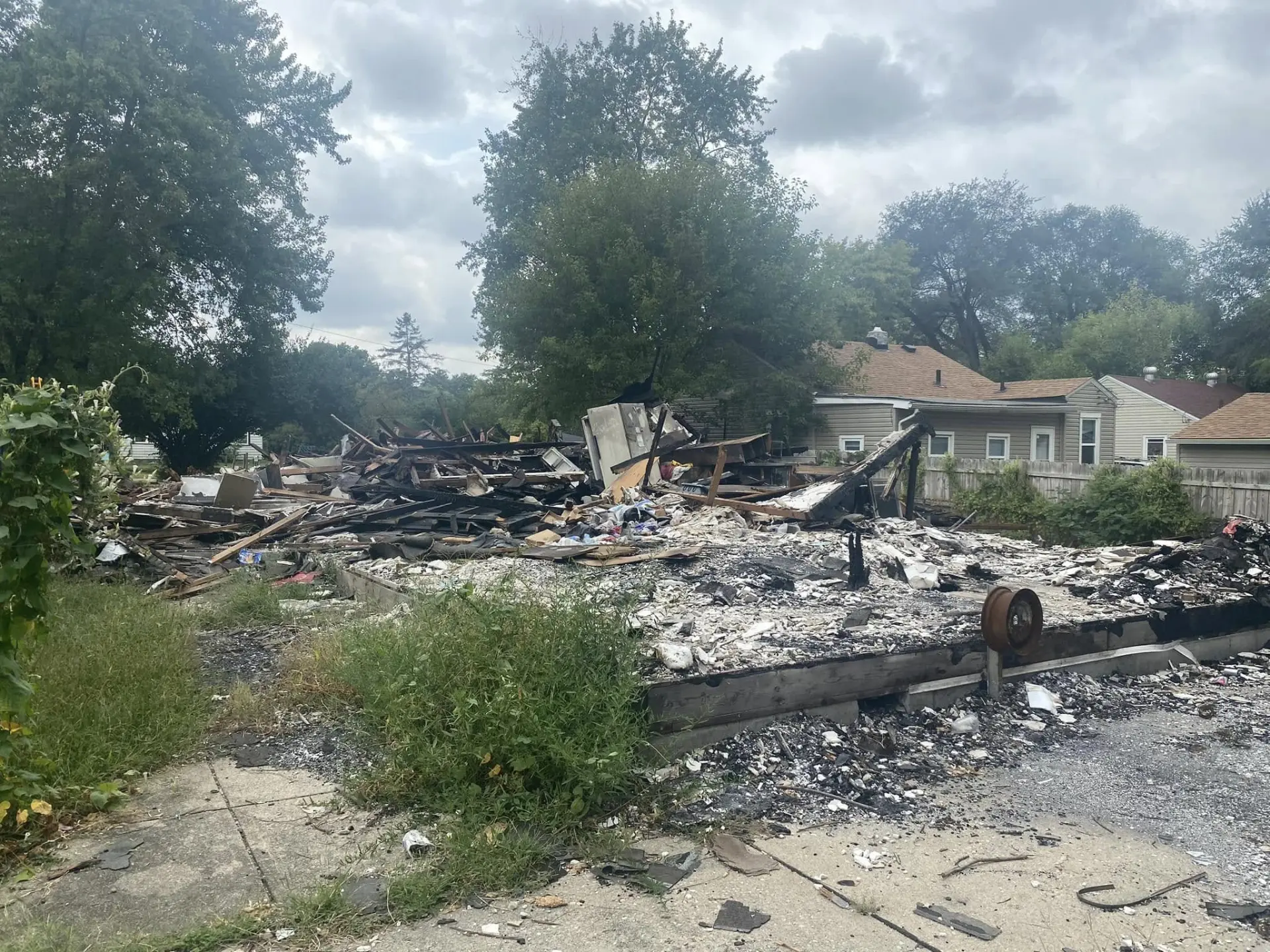 Property lot after a house fire, before cleanup